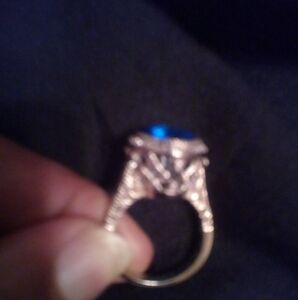 Beautiful Blue stone surrounded by cz diamonds ring